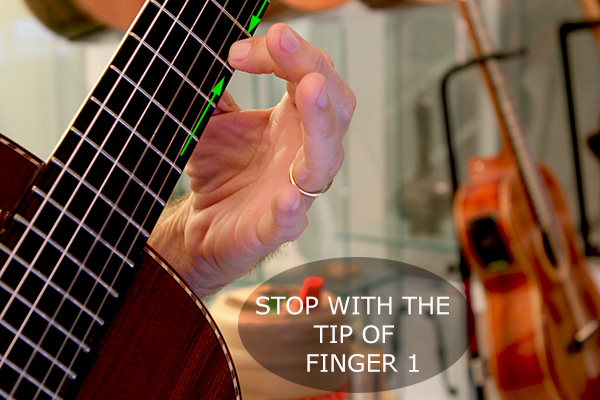 Stop the note with the tip of the finger