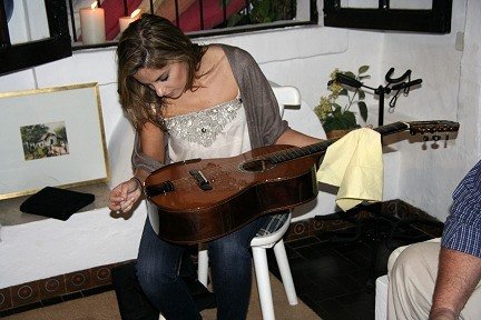 Guitarist Ana Vidovic, looking at the violin tie system used on the guitars